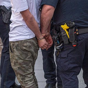 Pro-Palestinian protesters face off with police in a violent clash in Times Square during a pro-Israeli rally resulting in dozens of arrests.